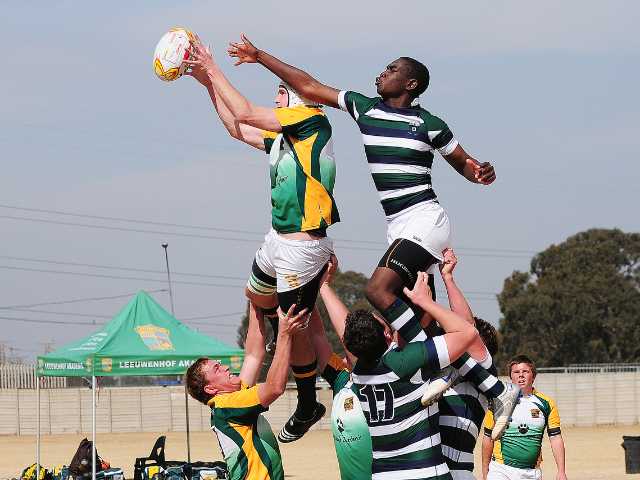 Rugby players competing in a lineout.