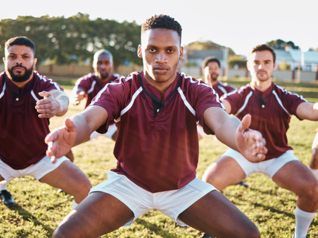 Rugby players performing a traditional haka before a match.