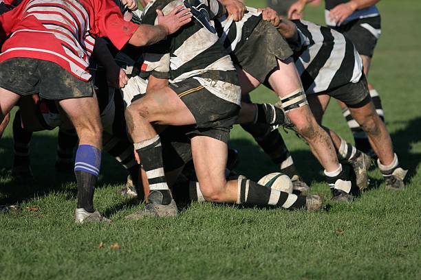 Close-up of players engaging in a scrum during a rugby match.