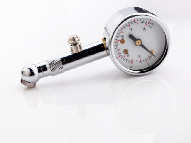 A close-up image of a pressure gauge designed to check ball inflation levels.