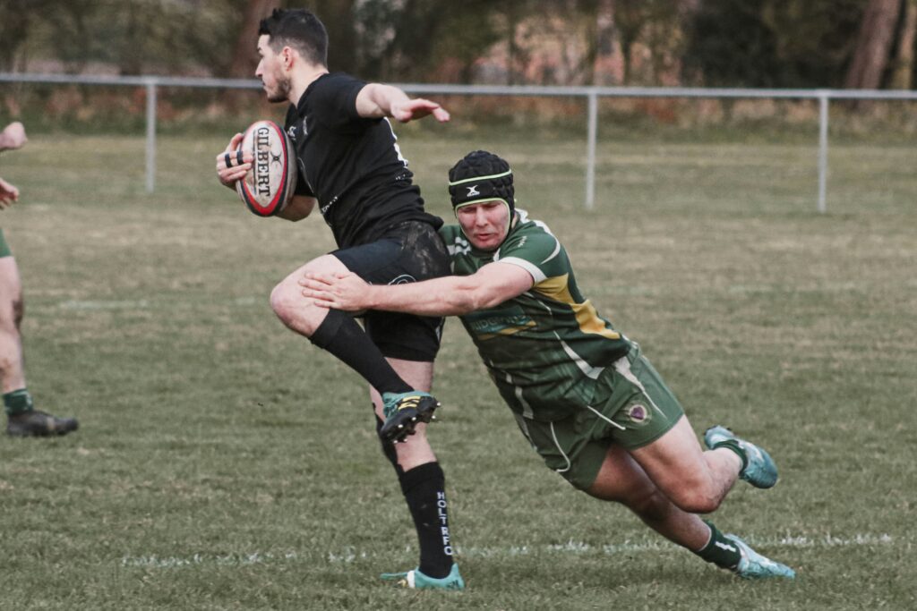 two person playing rugby