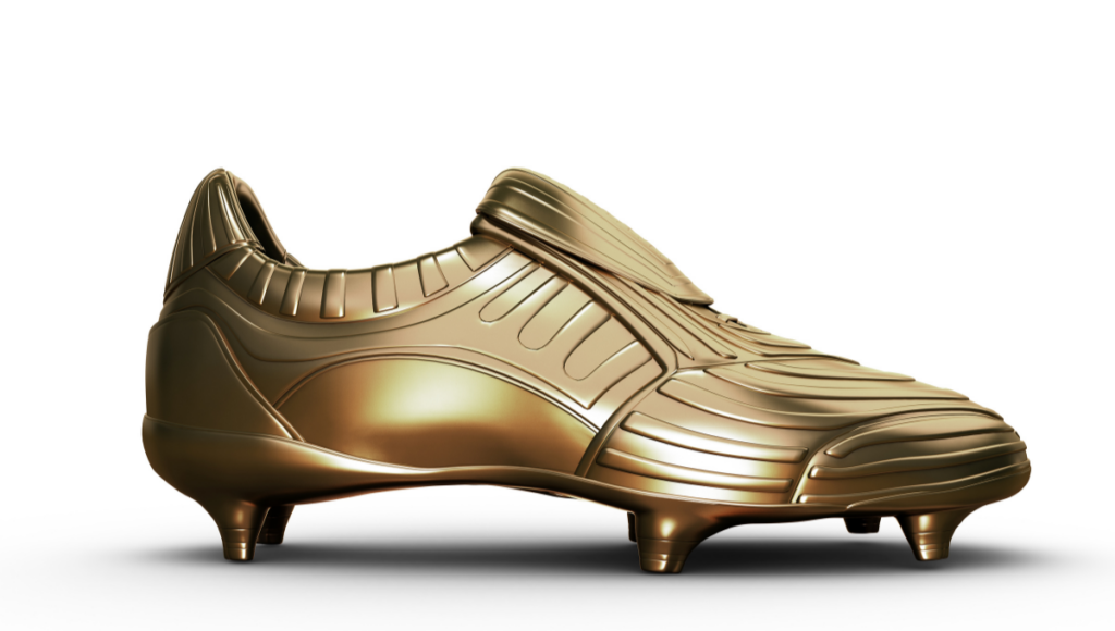 A sleek gold-colored rugby boot with a futuristic design, featuring metal studs for traction on the field.