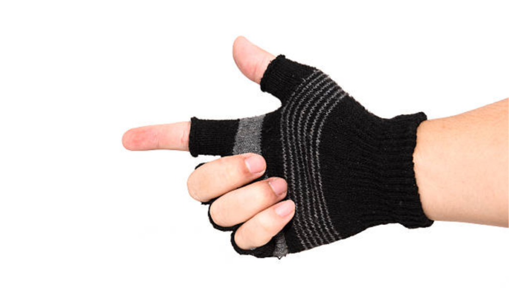 A hand pointing forward, wearing a black fingerless glove with grey stripes.