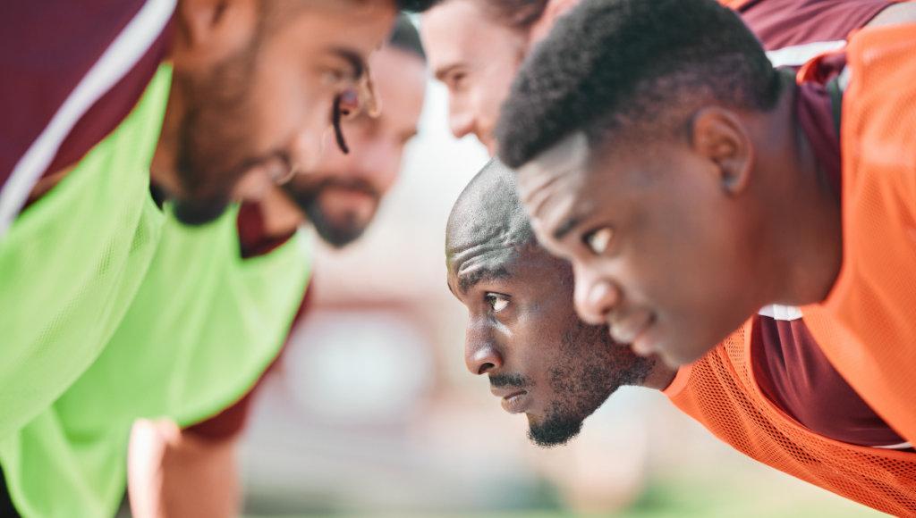 A close view of a rugby scrum, with players in position, ready to scrum.